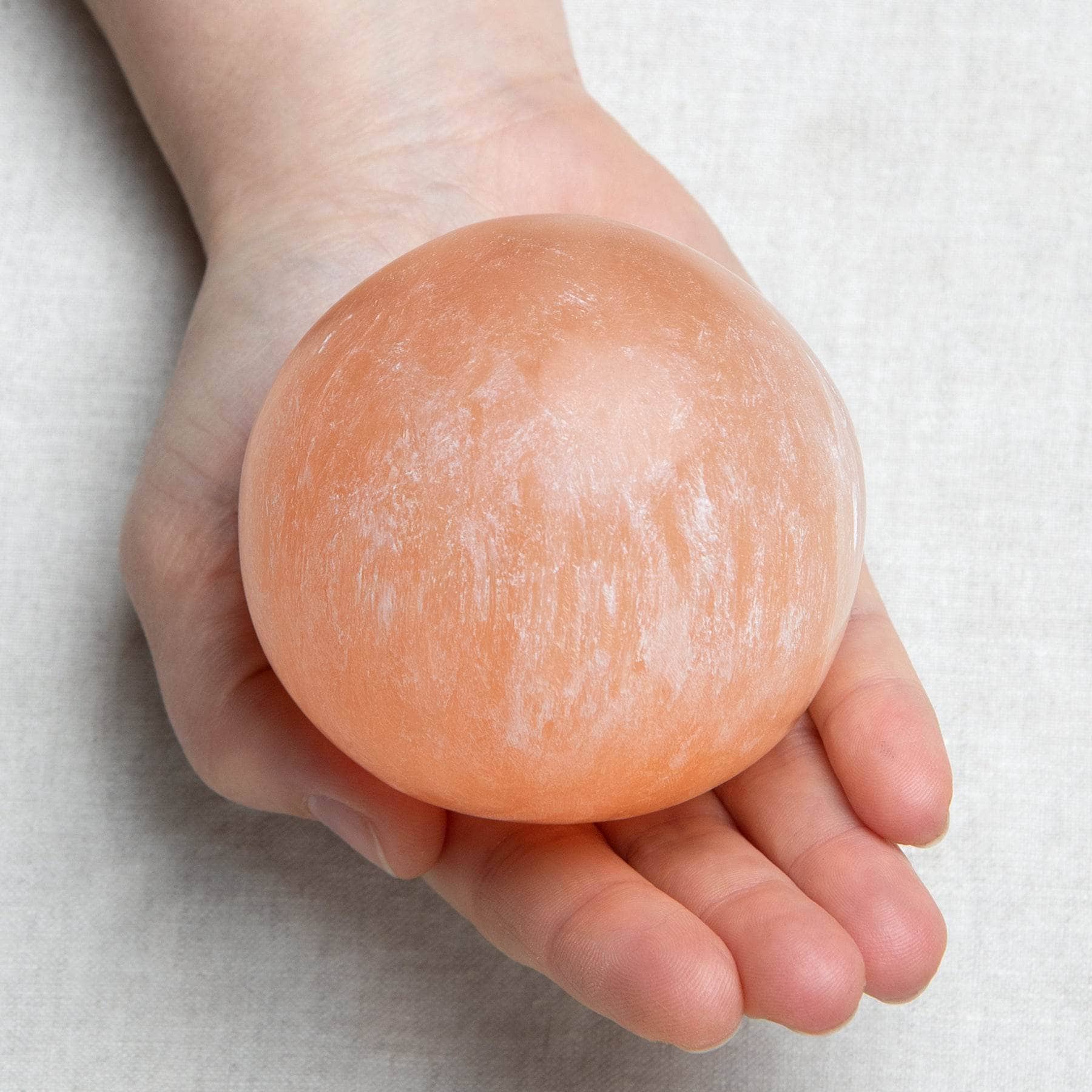 Studio-Session-641-2 Peach Selenite Sphere with Tripod - Image 4