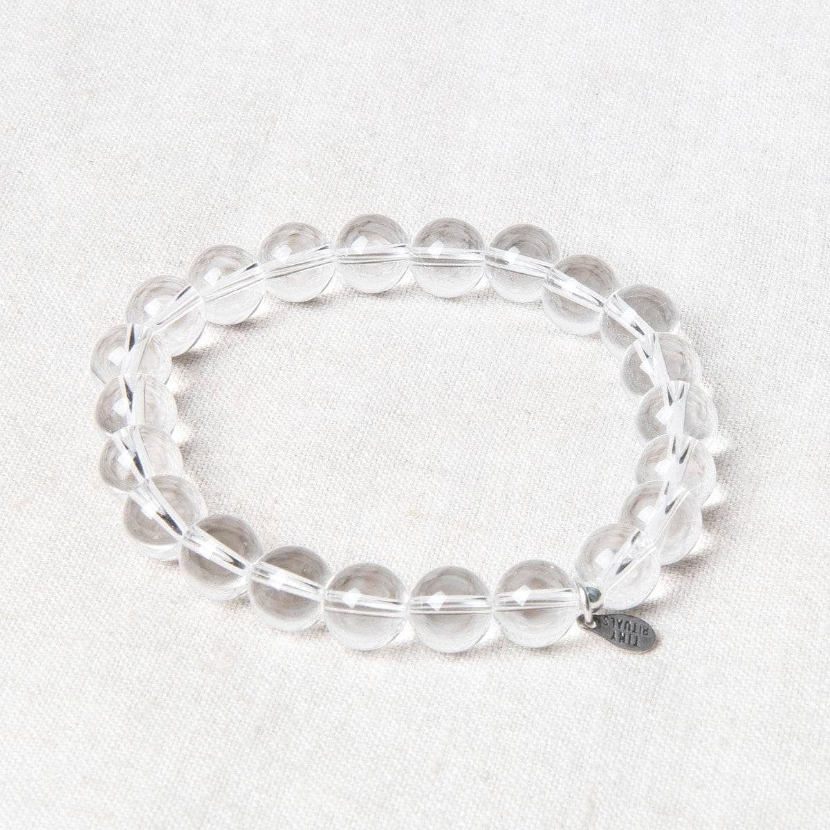 StudioSession-19893-1 Clear Quartz Energy Bracelet 8mm - Image 1